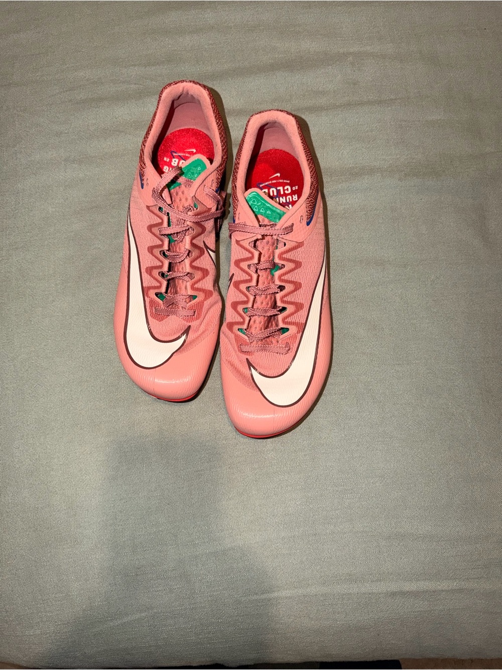 Nike Women’s Coral Pink Athletic Running Shoes with White Swoosh